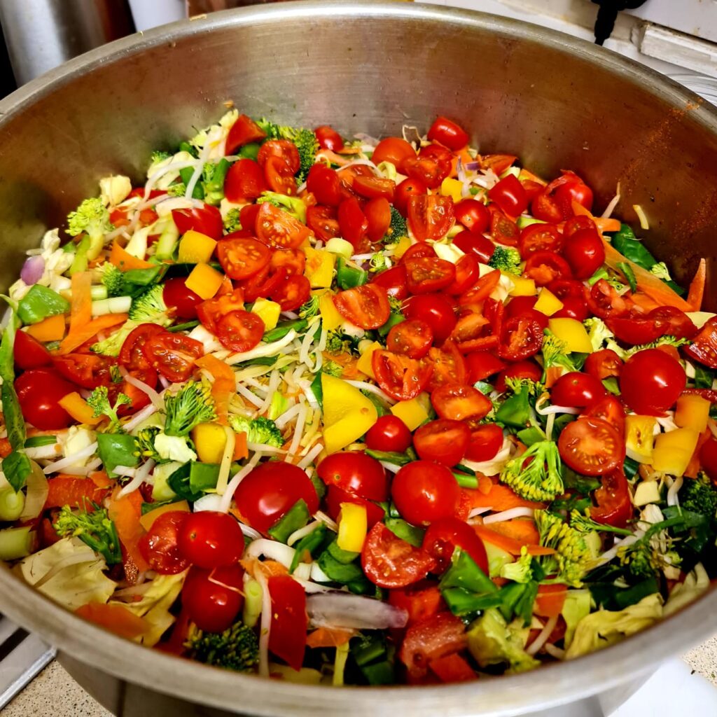 Saucepan with a variety of chopped vegetables