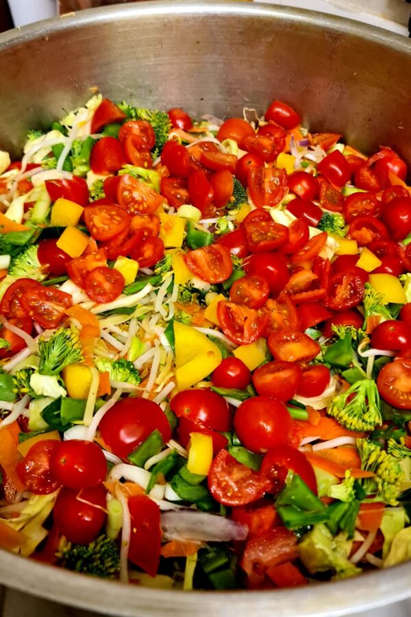 Saucepan with a variety of chopped vegetables